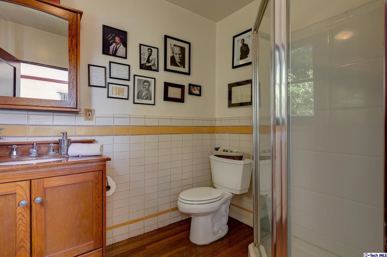 3301 Mount Curve Avenue Altadena, CA 91001 - Photo 24 of 29 a bathroom with a toilet sink and mirror