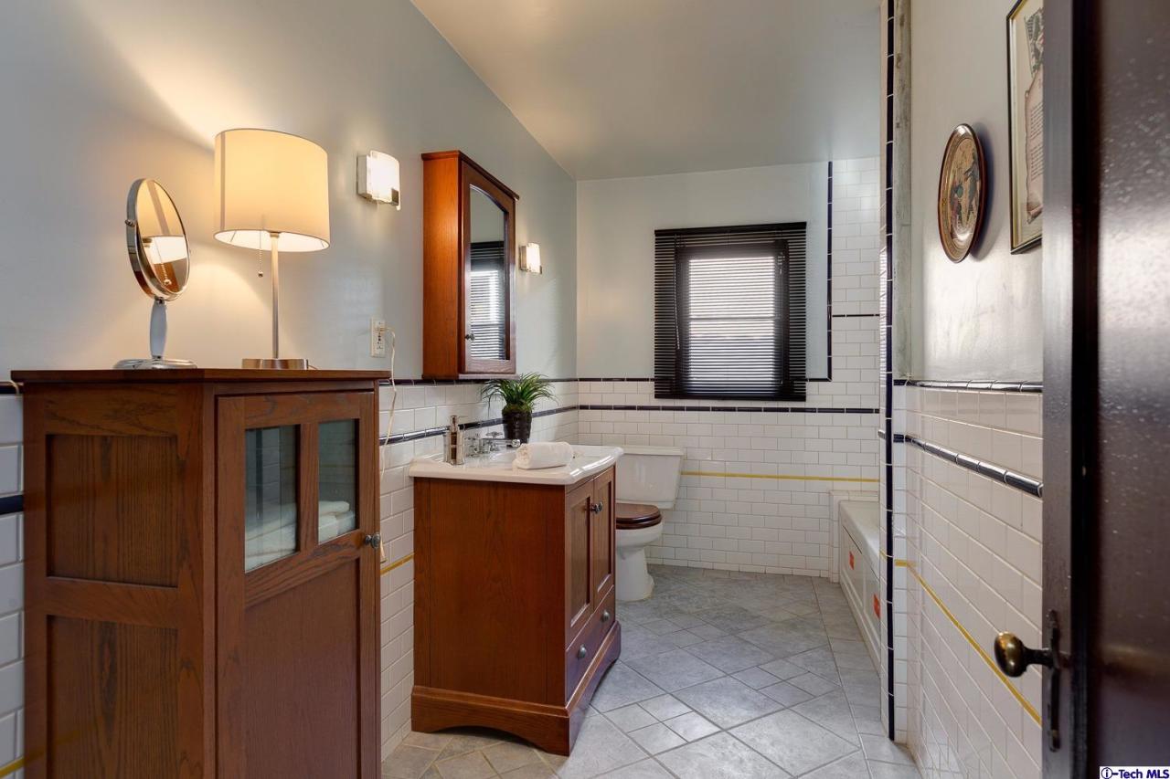 3301 Mount Curve Avenue Altadena, CA 91001 - Photo 27 of 29 a bathroom with a sink and a mirror