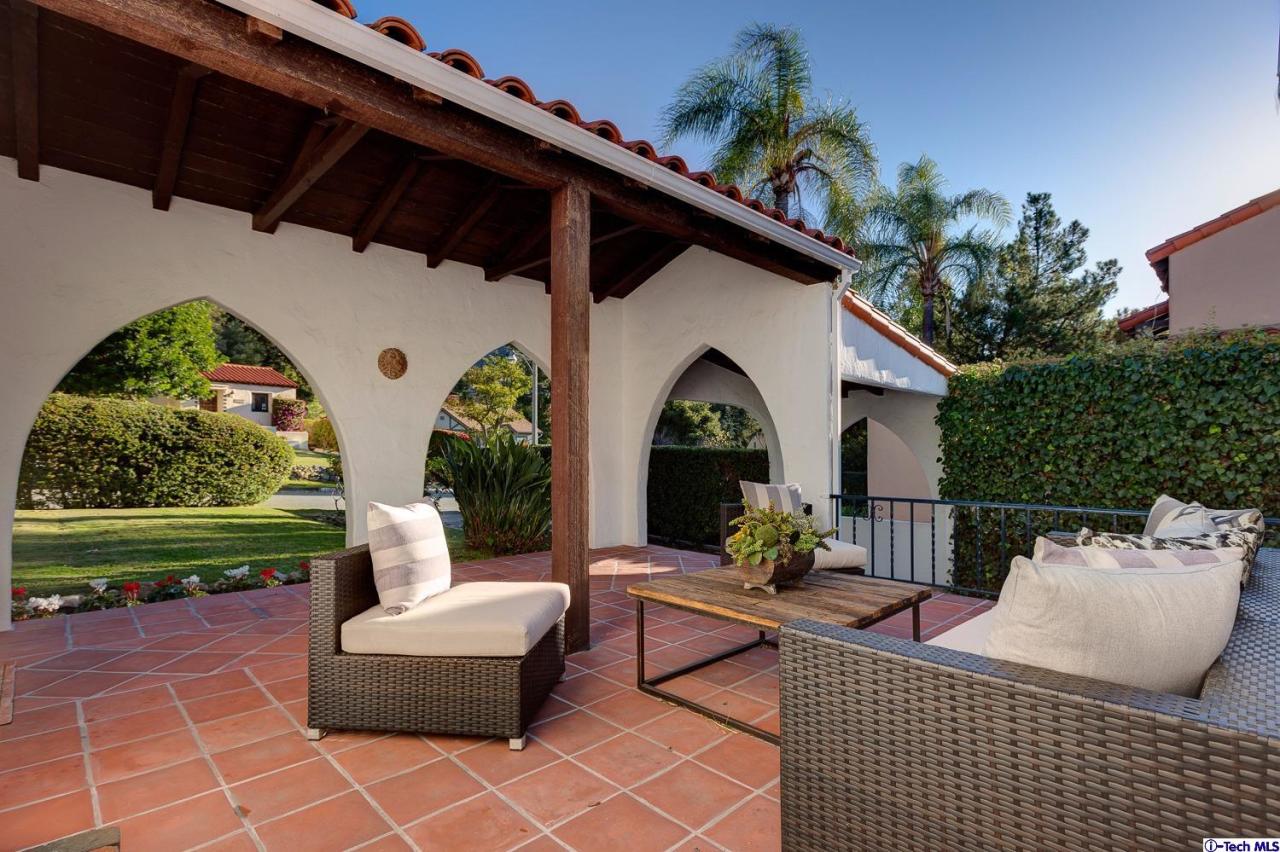 3301 Mount Curve Avenue Altadena, CA 91001 - Photo 5 of 29 a view of a patio with couches table and chairs and potted plants