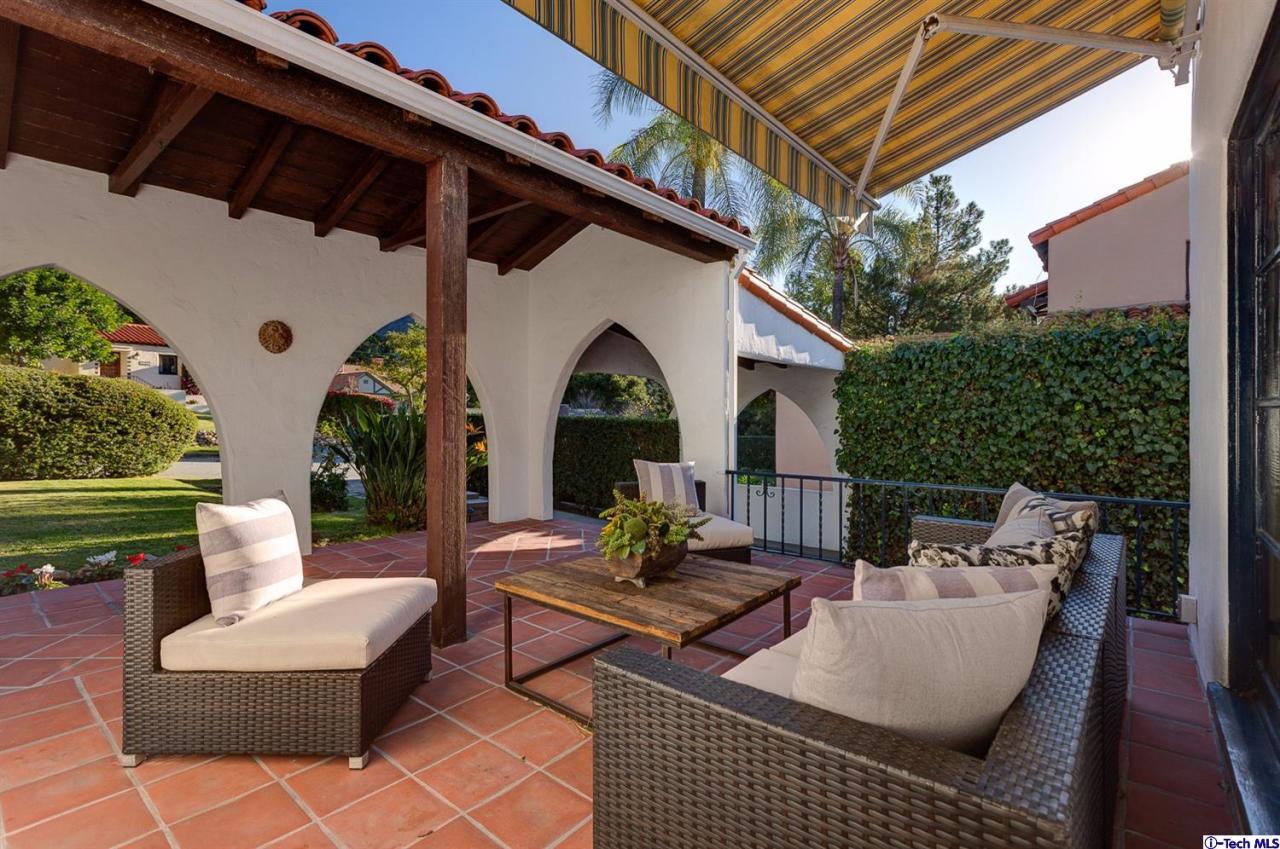 3301 Mount Curve Avenue Altadena, CA 91001 - Photo 6 of 29 a view of a patio with couches table and chairs and potted plants