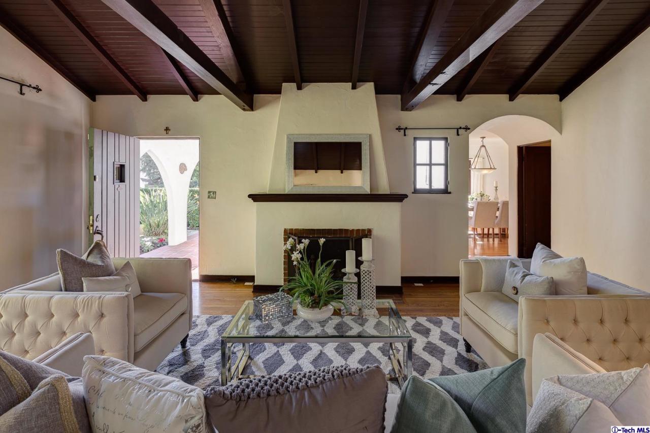 3301 Mount Curve Avenue Altadena, CA 91001 - Photo 8 of 29 a living room with furniture a fireplace and a table