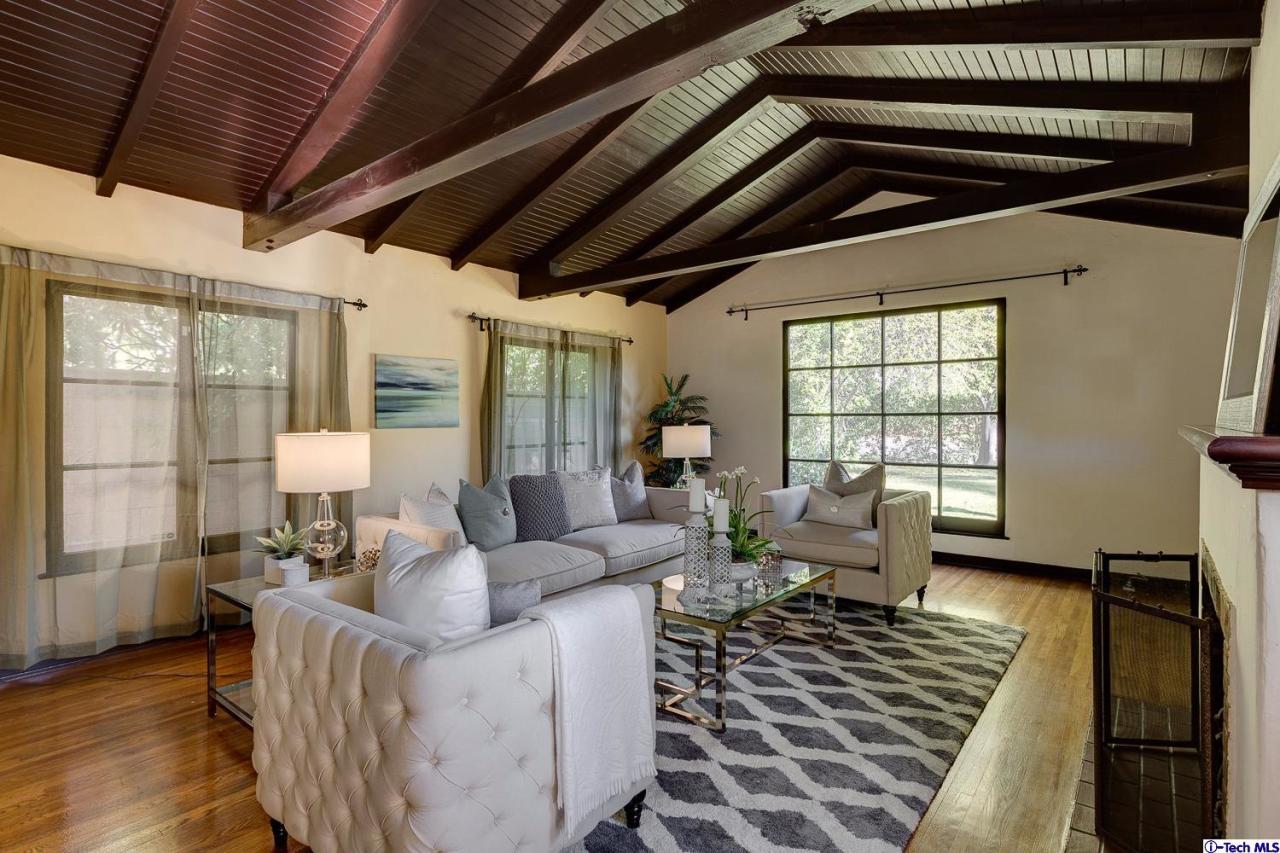 3301 Mount Curve Avenue Altadena, CA 91001 - Photo 9 of 29 a living room with furniture and wooden floor