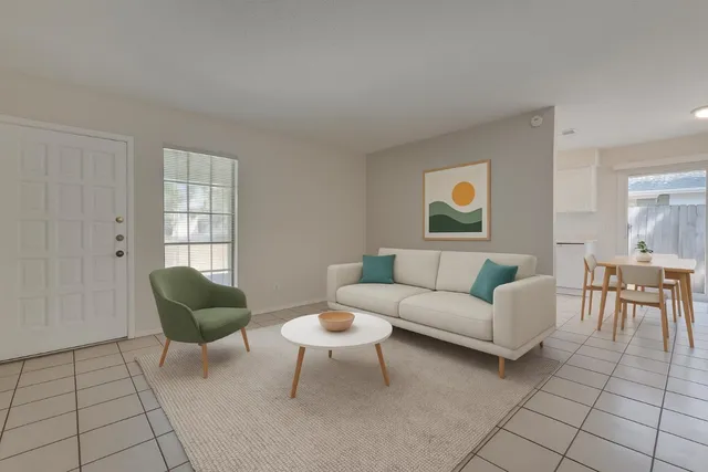 a living room with furniture and a window