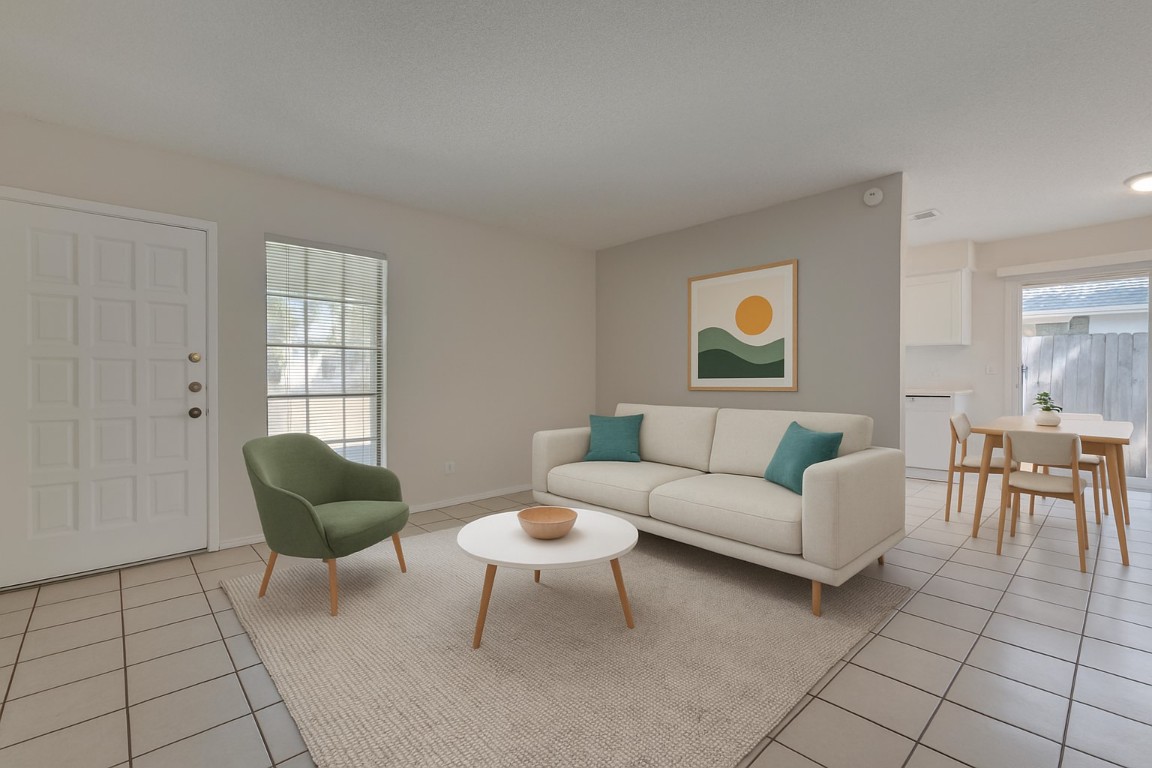 a living room with furniture and a window