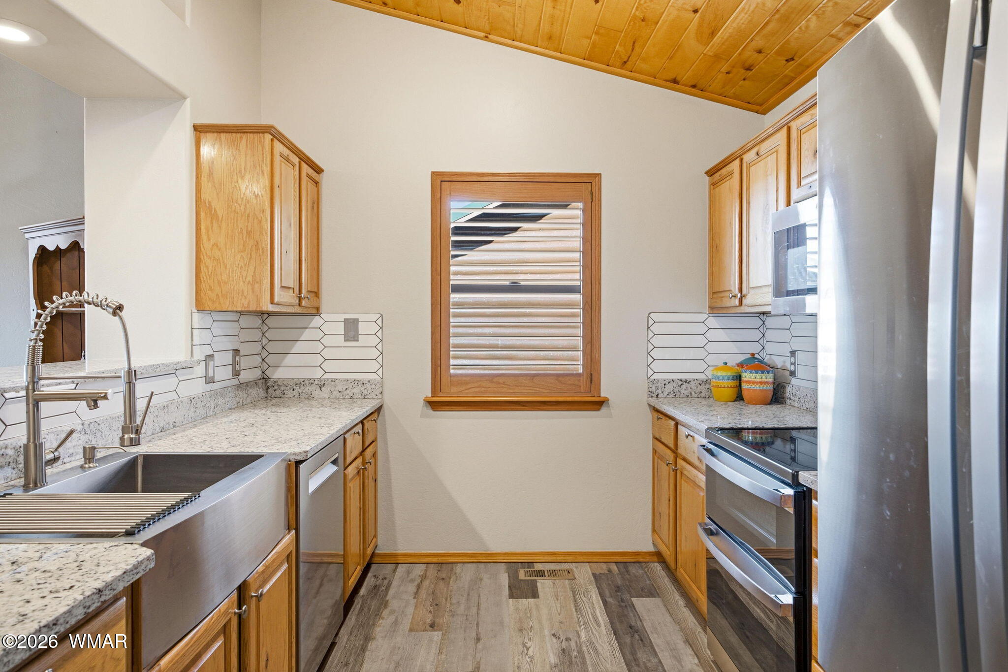 2660 Palomino Trail Overgaard, AZ 85933 - Photo 9 of 60 a kitchen with a sink and wooden floor