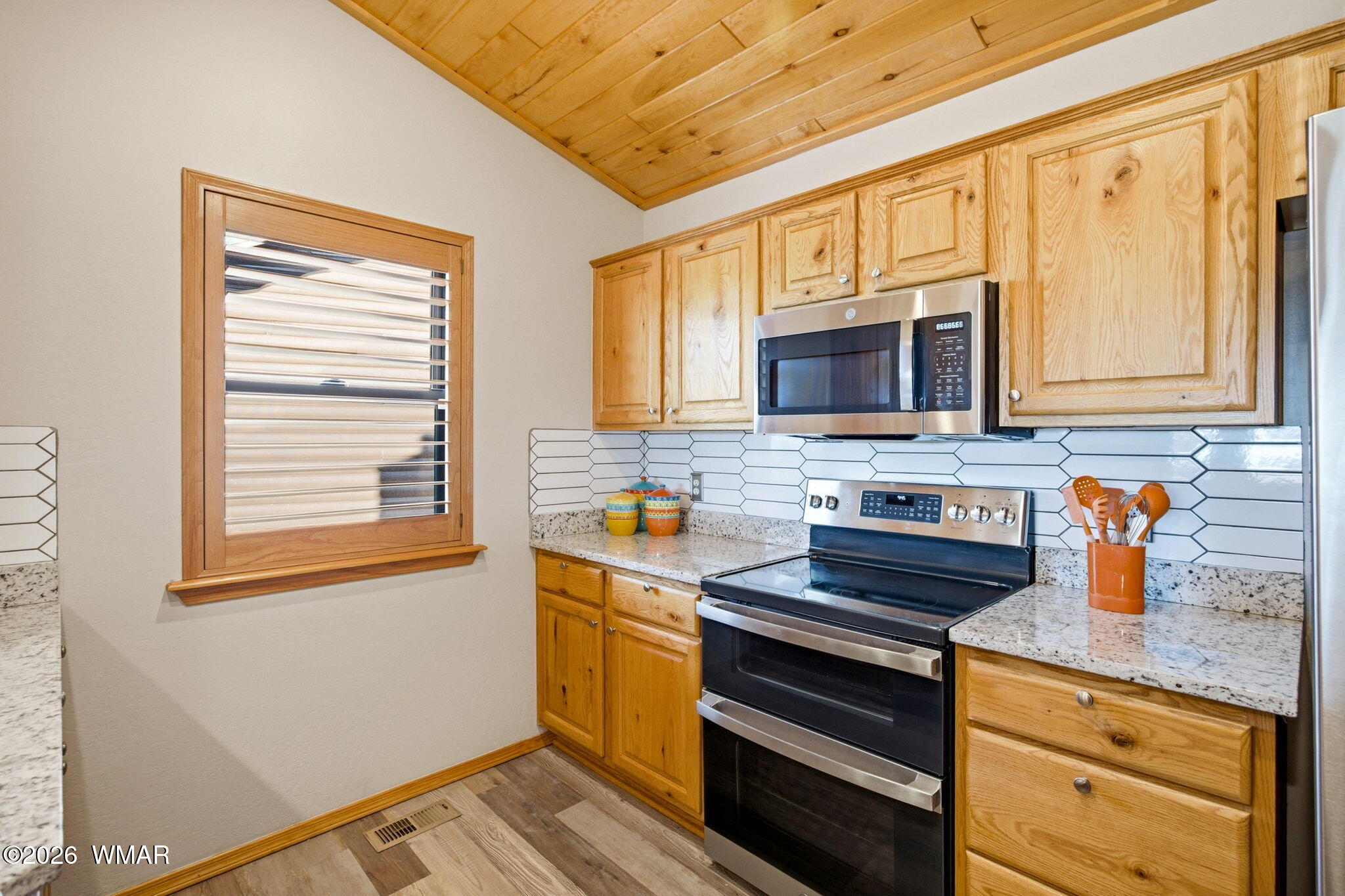 2660 Palomino Trail Overgaard, AZ 85933 - Photo 10 of 60 a kitchen with stainless steel appliances a stove sink and microwave