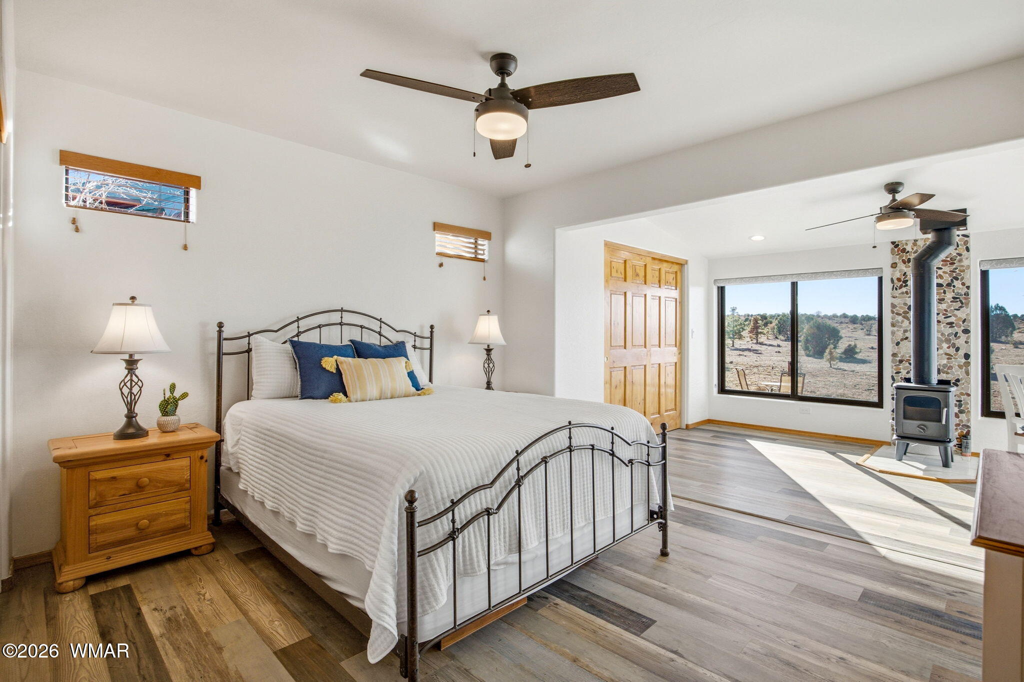 2660 Palomino Trail Overgaard, AZ 85933 - Photo 12 of 60 a bedroom with a bed and wooden floor