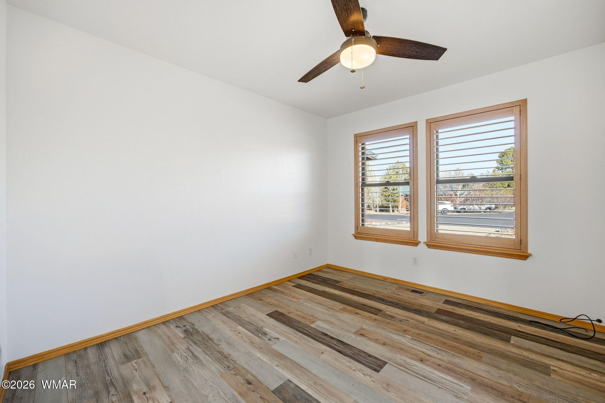 2660 Palomino Trail Overgaard, AZ 85933 - Photo 19 of 60 a bedroom with bed and a window