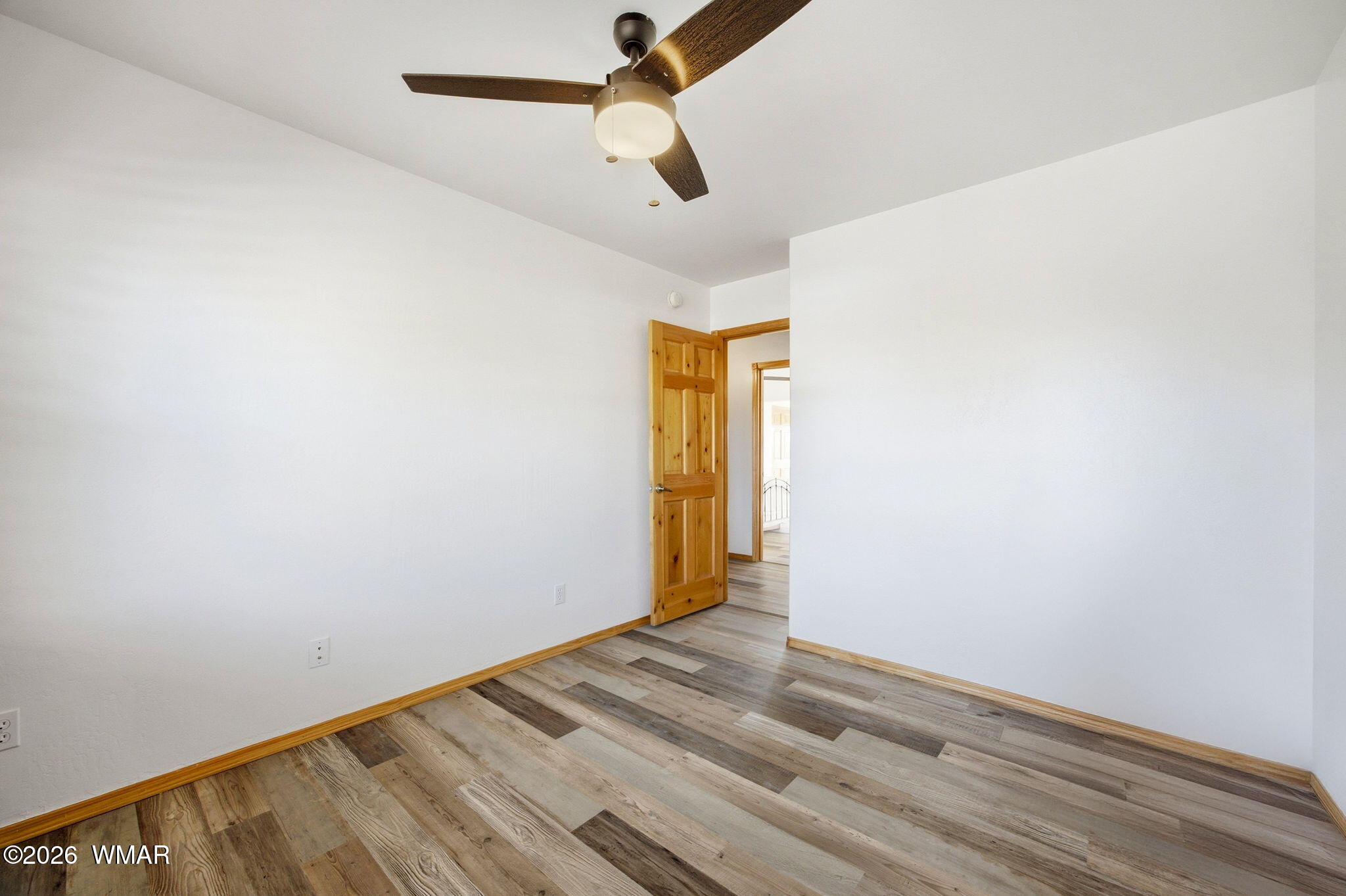 2660 Palomino Trail Overgaard, AZ 85933 - Photo 20 of 60 a view of room with wooden floor