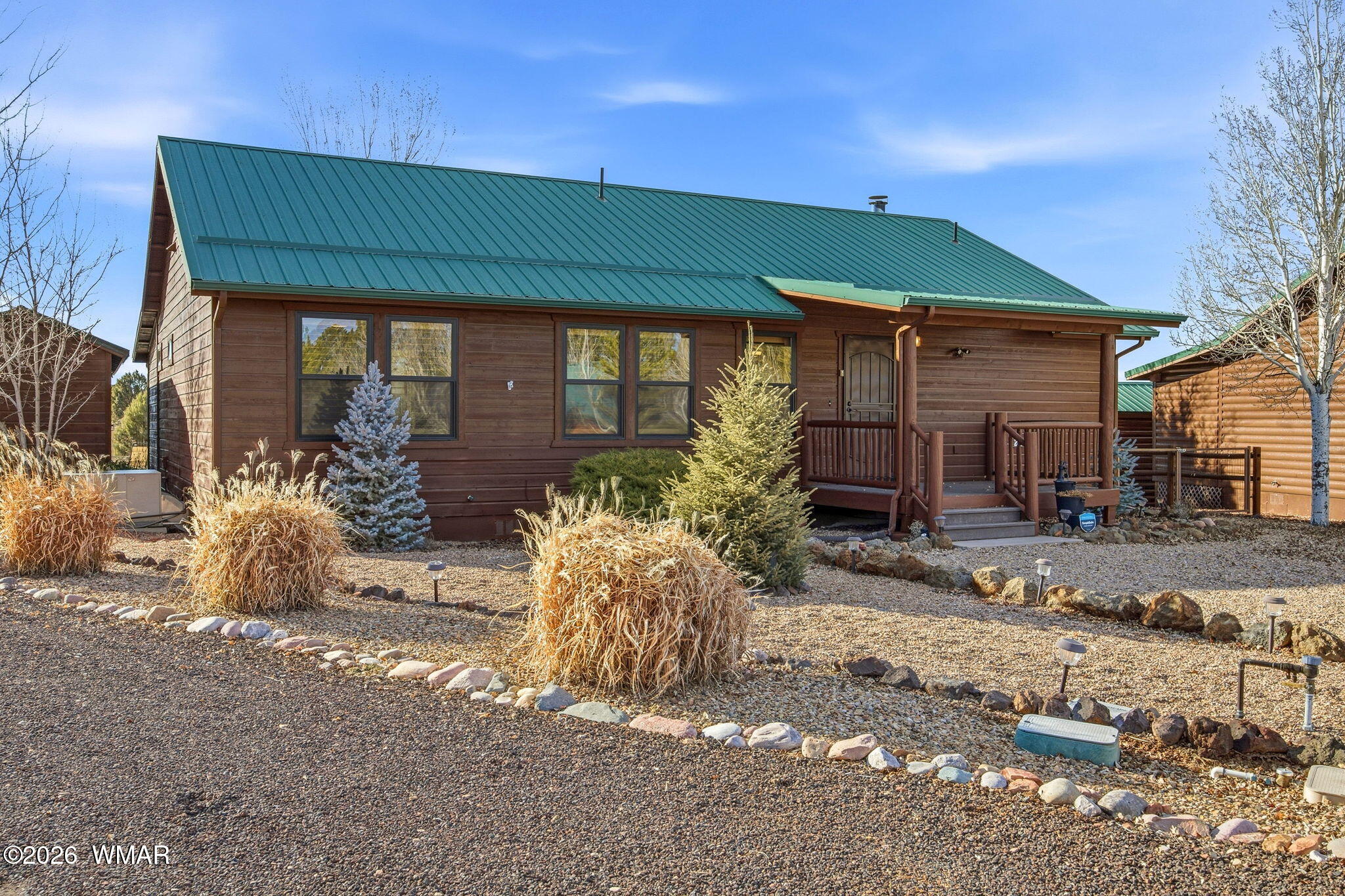 2660 Palomino Trail Overgaard, AZ 85933 - Photo 37 of 60 a front view of a house with garden