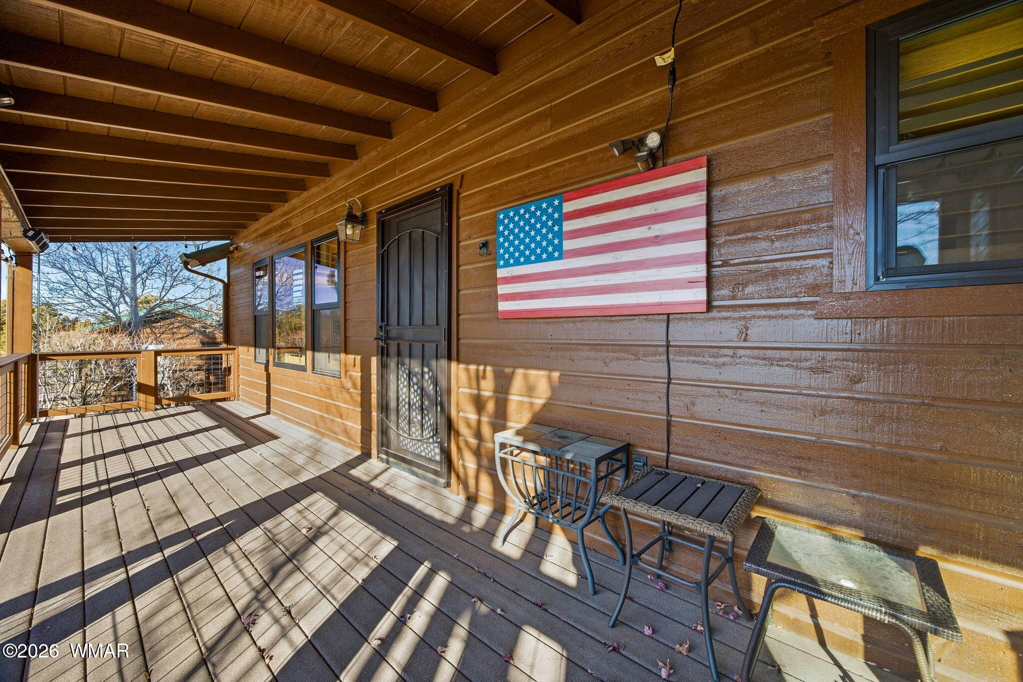 2660 Palomino Trail Overgaard, AZ 85933 - Photo 42 of 60 a view of a patio with table and chairs with wooden floor and fence