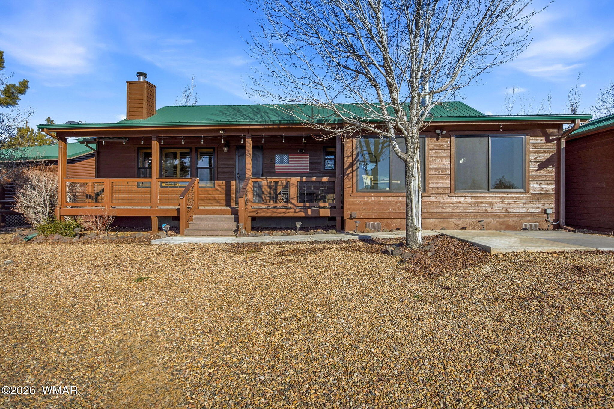 2660 Palomino Trail Overgaard, AZ 85933 - Photo 43 of 60 a front view of a house with garden