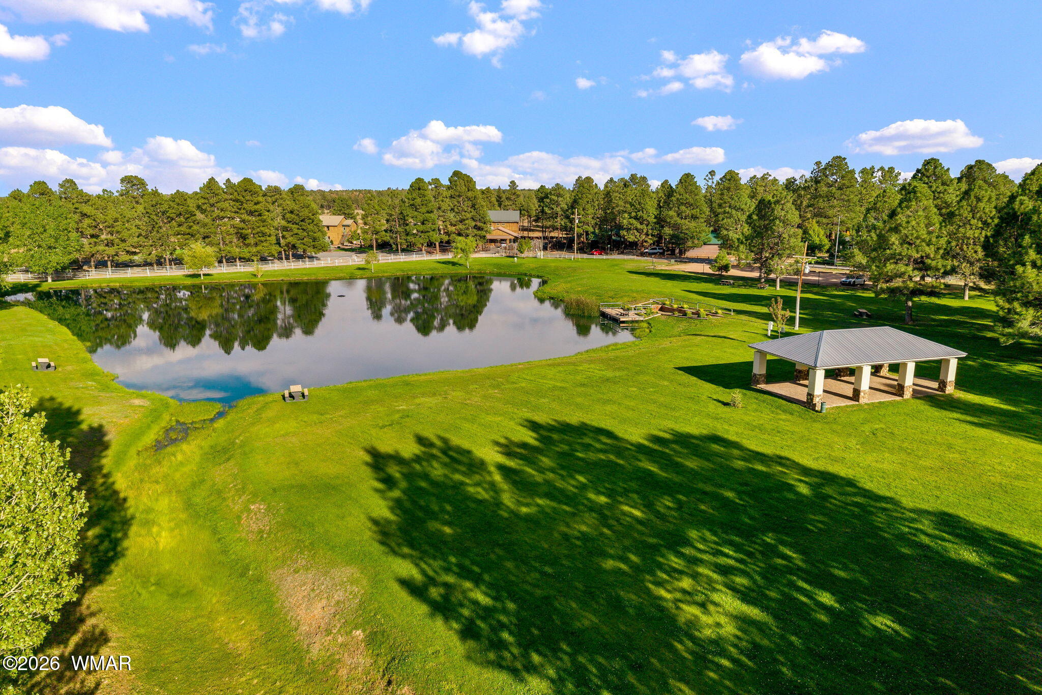 2660 Palomino Trail Overgaard, AZ 85933 - Photo 54 of 60 a view of a lake with houses in the back