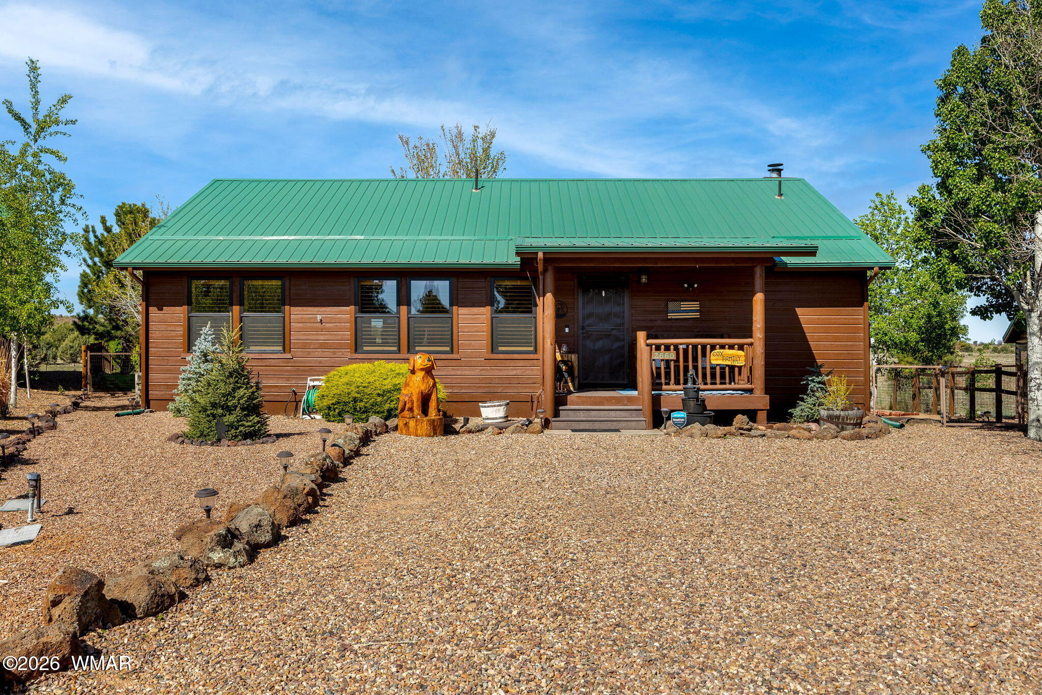 2660 Palomino Trail Overgaard, AZ 85933 - Photo 58 of 60 a backyard of a house with yard and outdoor seating