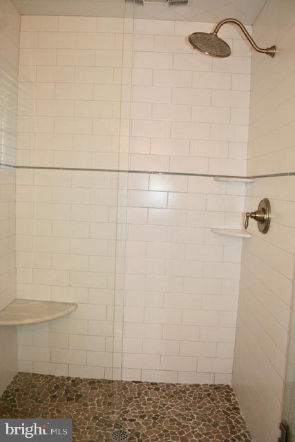132 Cascade Road Springfield, PA 19064 - Photo 36 of 65 Subway tile & river rock shower