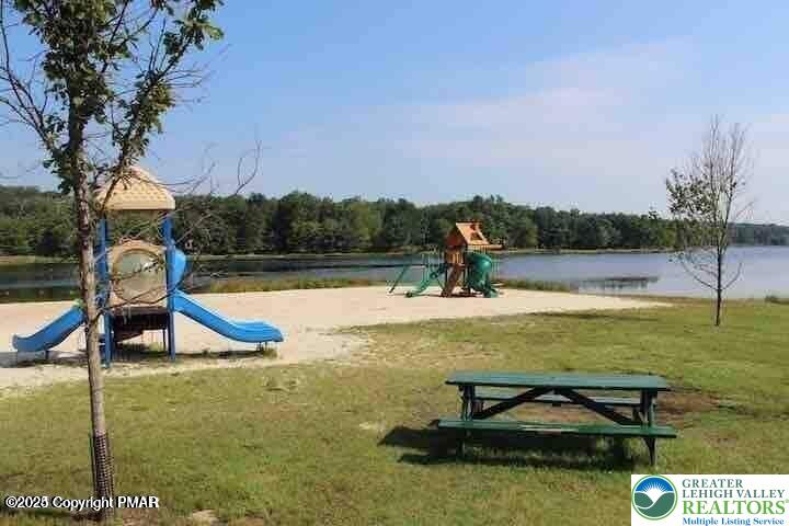 407 Pinetree Road Albrightsville, PA 18210 - Photo 11 of 18 a view of a lake with a yard