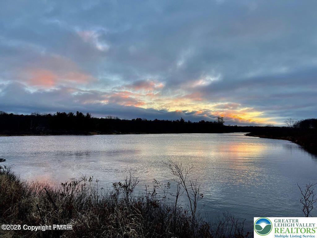 407 Pinetree Road Albrightsville, PA 18210 - Photo 5 of 18 a view of lake with sunset