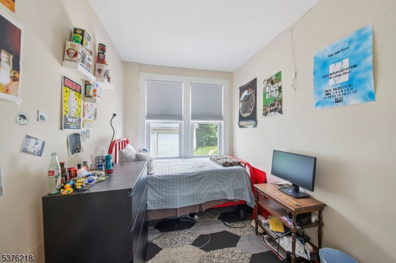44 Oberlin Street Maplewood, NJ 07040 - Photo 14 of 31 a living room with furniture and a window