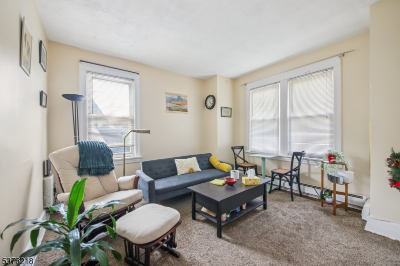 44 Oberlin Street Maplewood, NJ 07040 - Photo 16 of 31 a living room with furniture and a window