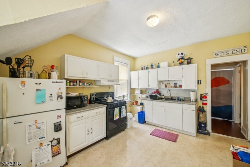44 Oberlin Street Maplewood, NJ 07040 - Photo 17 of 31 a kitchen with cabinets and appliances