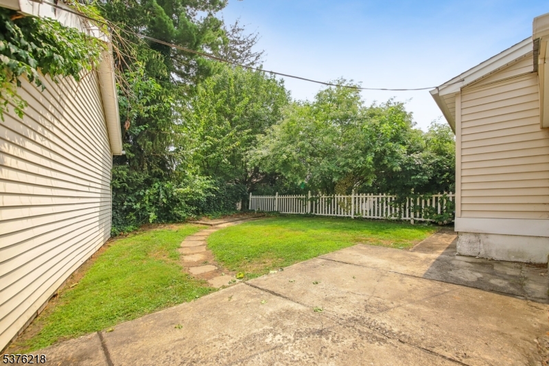 44 Oberlin Street Maplewood, NJ 07040 - Photo 27 of 31 a view of a backyard with large trees