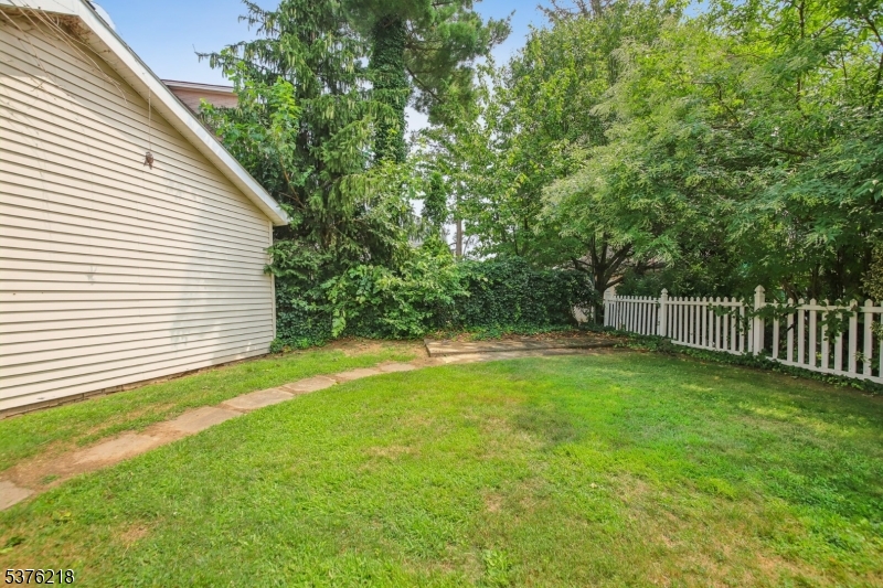 44 Oberlin Street Maplewood, NJ 07040 - Photo 28 of 31 a view of a backyard with a small cabin