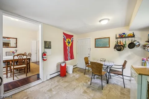 a view of a livingroom with furniture and white walls