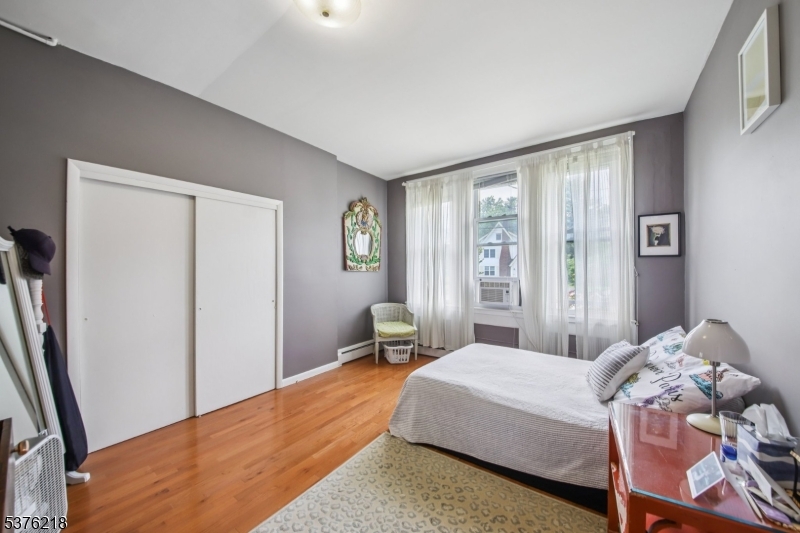 44 Oberlin Street Maplewood, NJ 07040 - Photo 10 of 31 a bedroom with a bed and a window