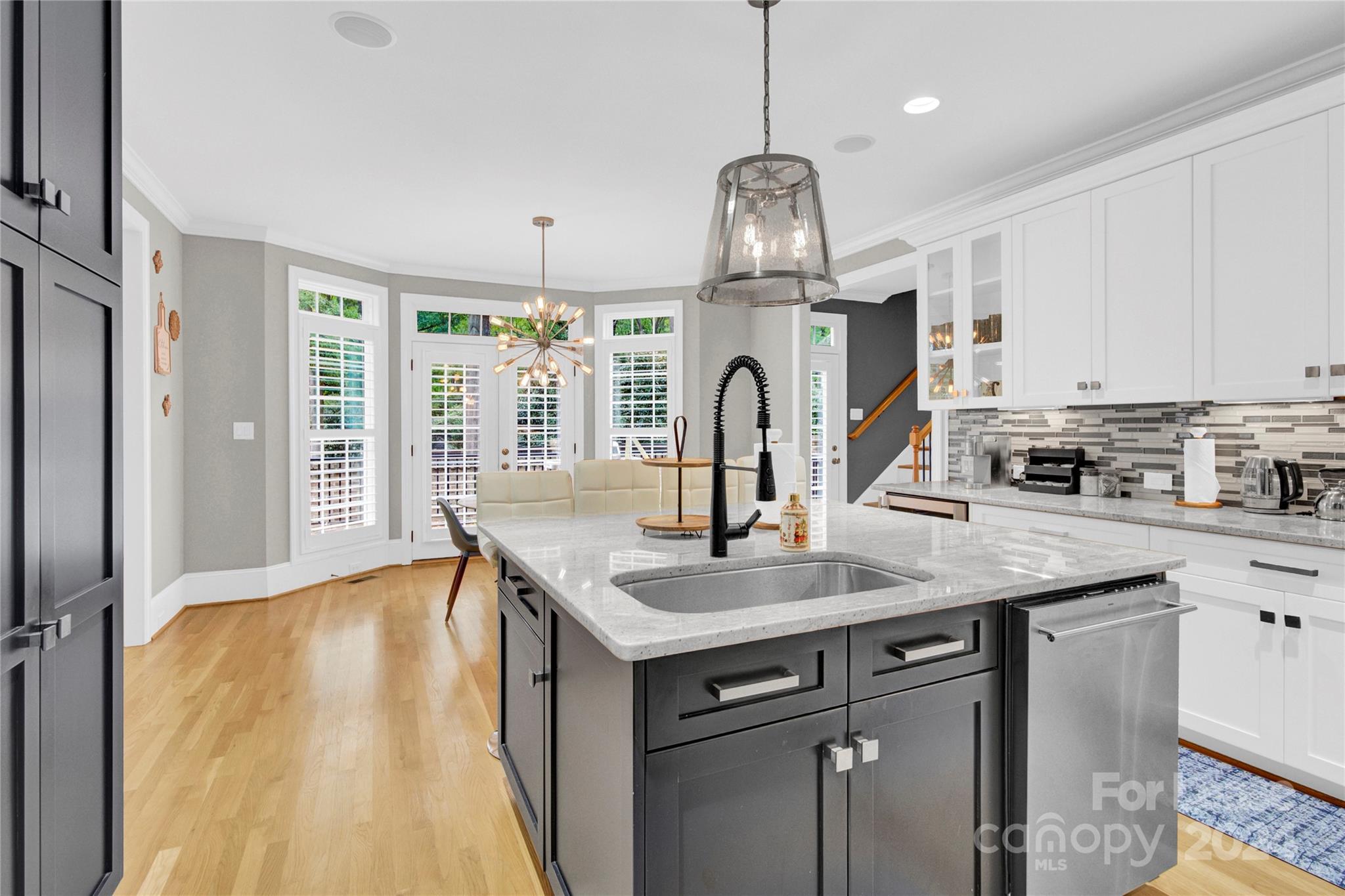 3012 Sharon View Road Charlotte, NC 28210 - Photo 24 of 48 a kitchen with stainless steel appliances granite countertop a sink a stove and a wooden floors