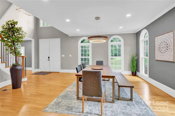 a view of a kitchen with furniture and a potted plant