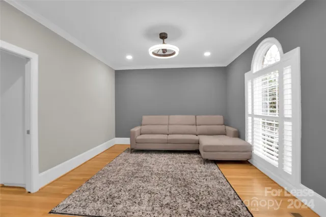 a living room with furniture and a rug