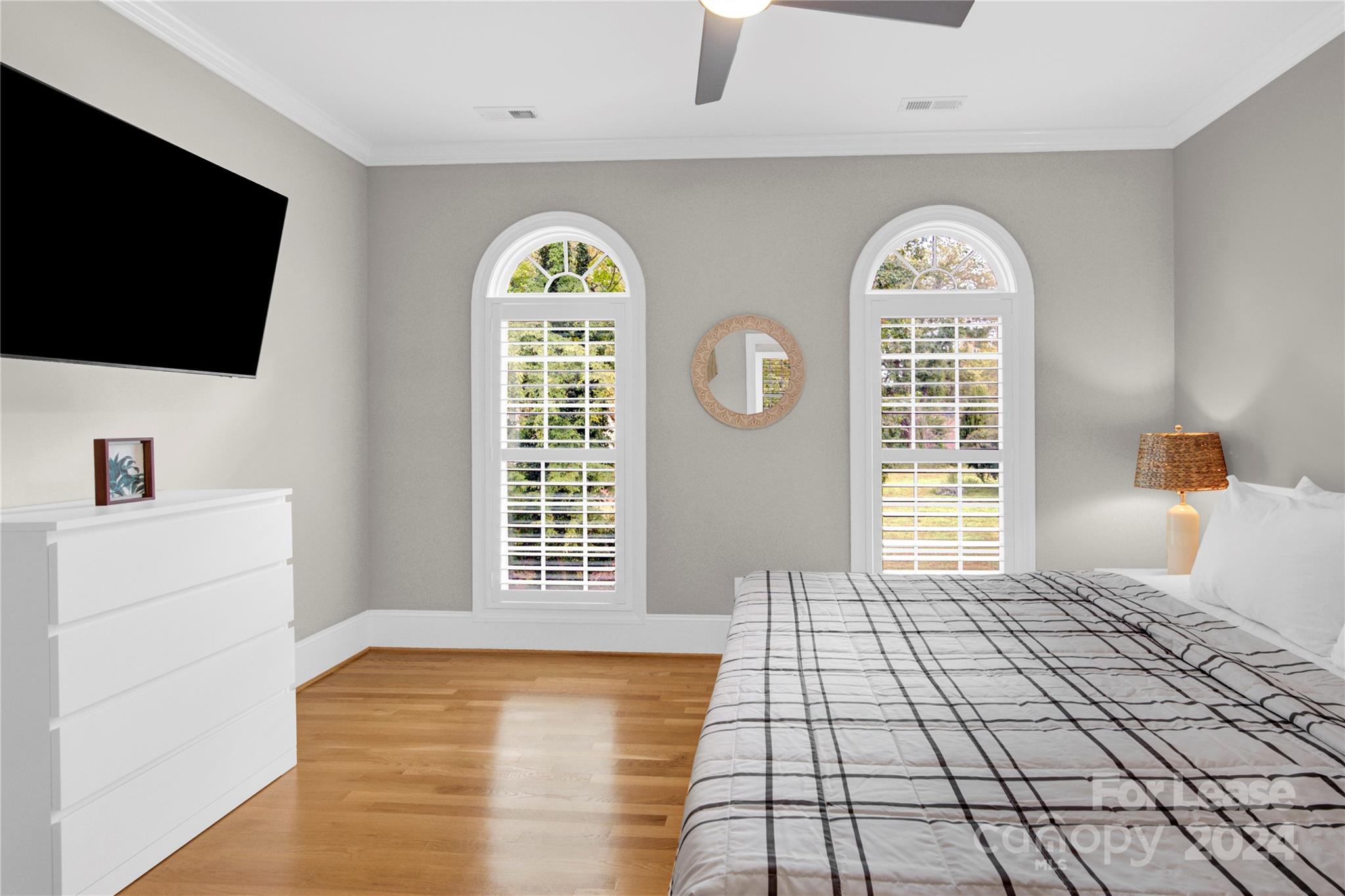 3012 Sharon View Road Charlotte, NC 28210 - Photo 46 of 48 a bedroom with a bed and a flat screen tv