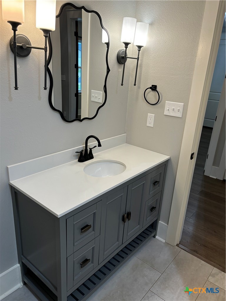 110 Hiram Cook Blanco, TX 78606 - Photo 18 of 46 a bathroom with a sink and mirror
