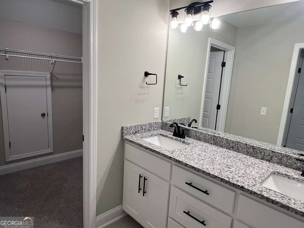 405 Madison Avenue St. Marys, GA 31558 - Photo 14 of 21 a bathroom with a granite countertop sink and a mirror