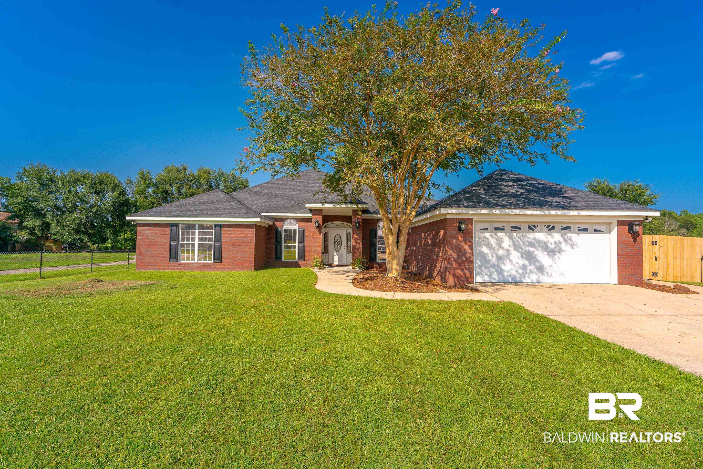 9477 Deerfield Drive Irvington, AL 36544 - Photo 52 of 58 Ranch-style home with a front yard and a garage