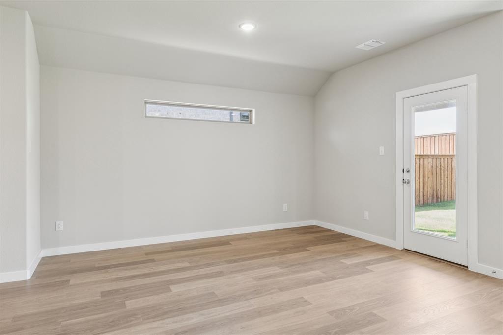 1468 Companero Street Haslet, TX 76052 - Photo 8 of 29 a view of a room with wooden floor