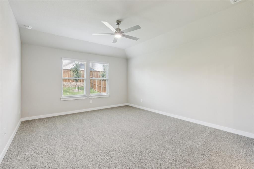1468 Companero Street Haslet, TX 76052 - Photo 13 of 29 an empty room with windows and fan