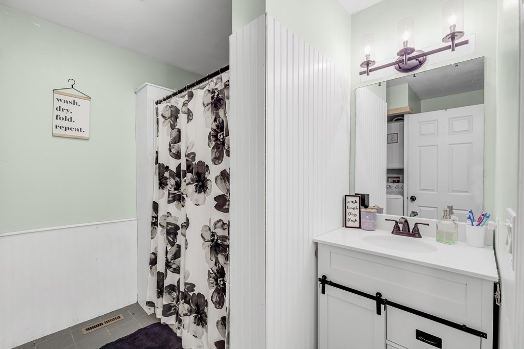 24 Sand Hill Road Salisbury, MA 01952 - Photo 13 of 28 a bathroom with a sink and a mirror