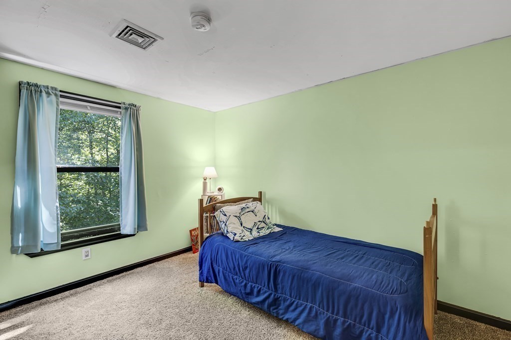 24 Sand Hill Road Salisbury, MA 01952 - Photo 22 of 28 a bedroom with a bed and window