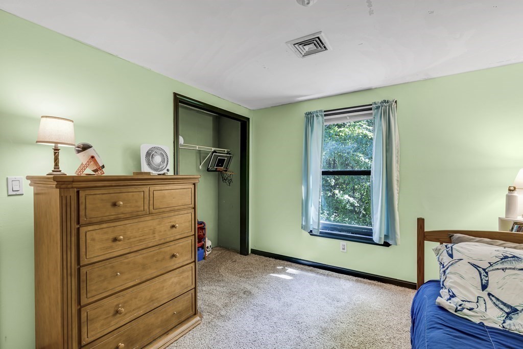 24 Sand Hill Road Salisbury, MA 01952 - Photo 23 of 28 a bed room with a bed and a window