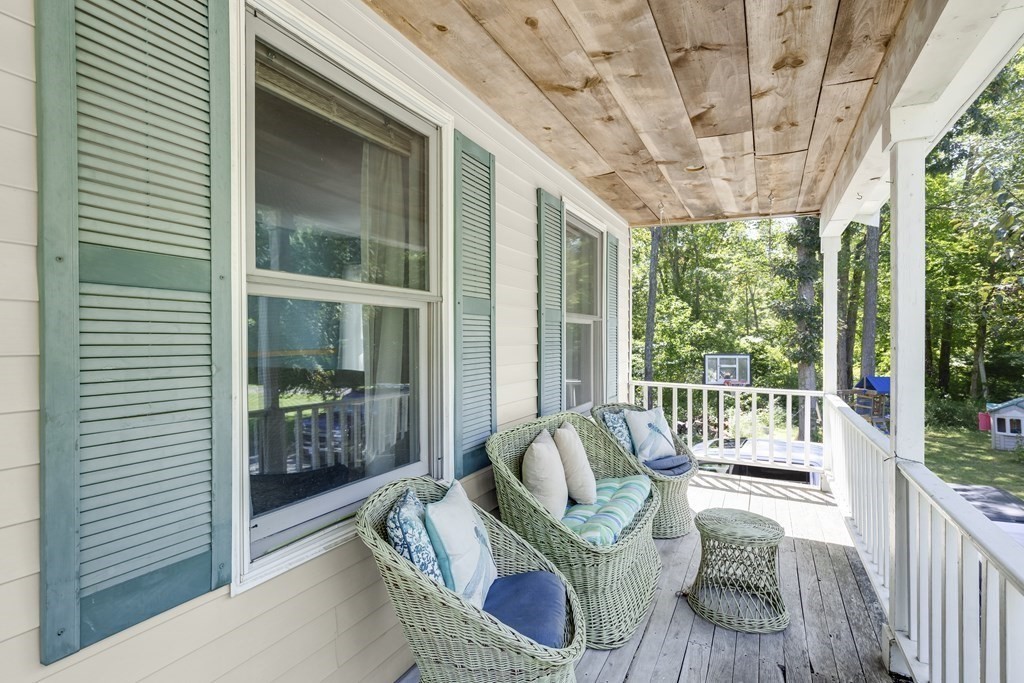 24 Sand Hill Road Salisbury, MA 01952 - Photo 27 of 28 a balcony with furniture and a potted plant
