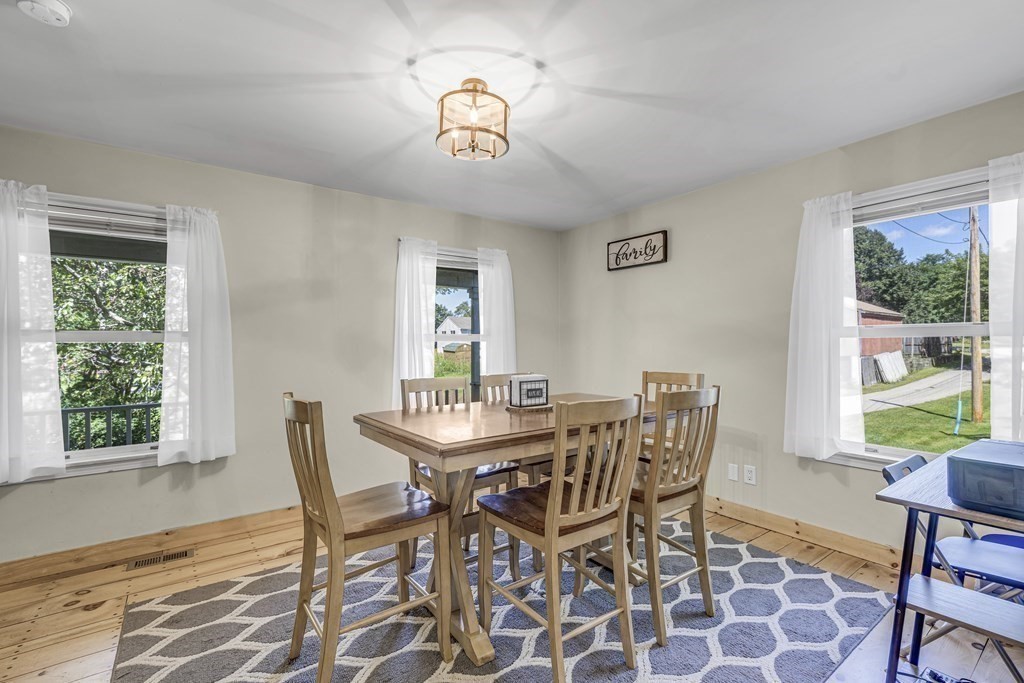24 Sand Hill Road Salisbury, MA 01952 - Photo 6 of 28 a view of a dining room with furniture window and outside view