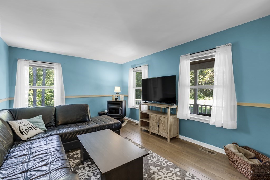 24 Sand Hill Road Salisbury, MA 01952 - Photo 9 of 28 a living room with furniture and a flat screen tv