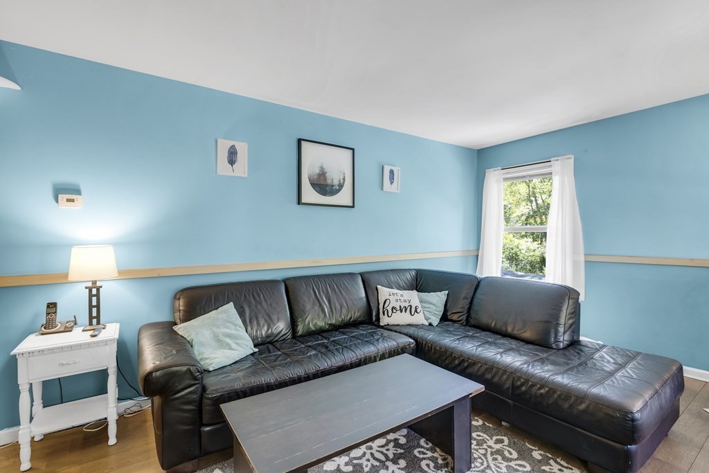 24 Sand Hill Road Salisbury, MA 01952 - Photo 10 of 28 a living room with furniture and a window