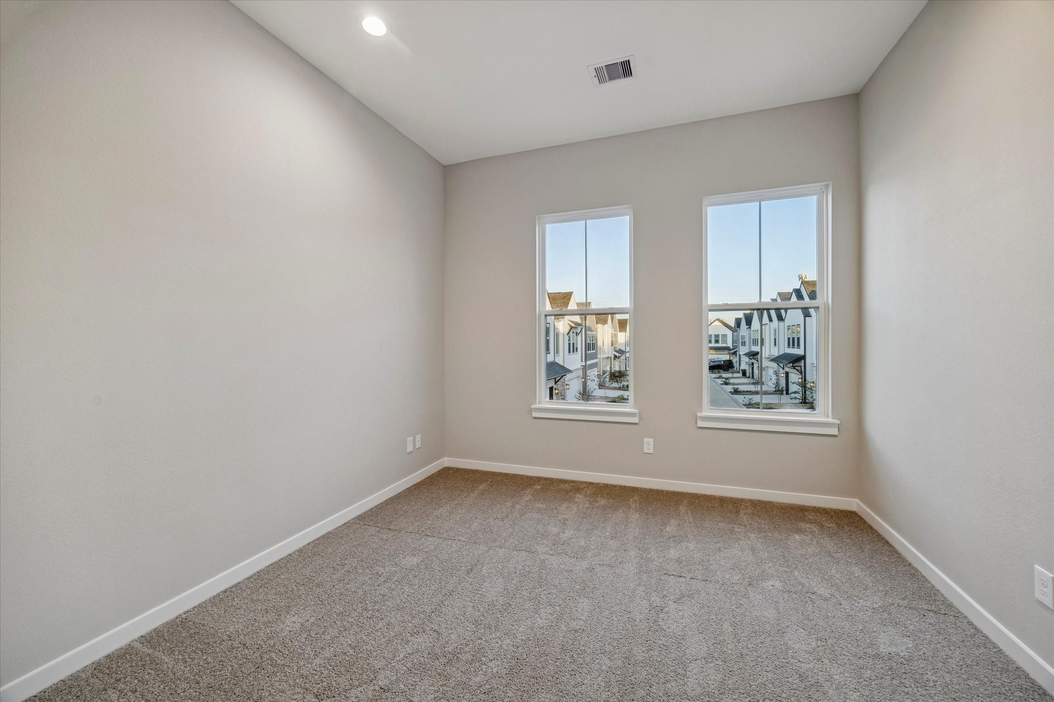 11307 Stonework Grove Lane Houston, TX 77076 - Photo 42 of 46 an empty room with windows