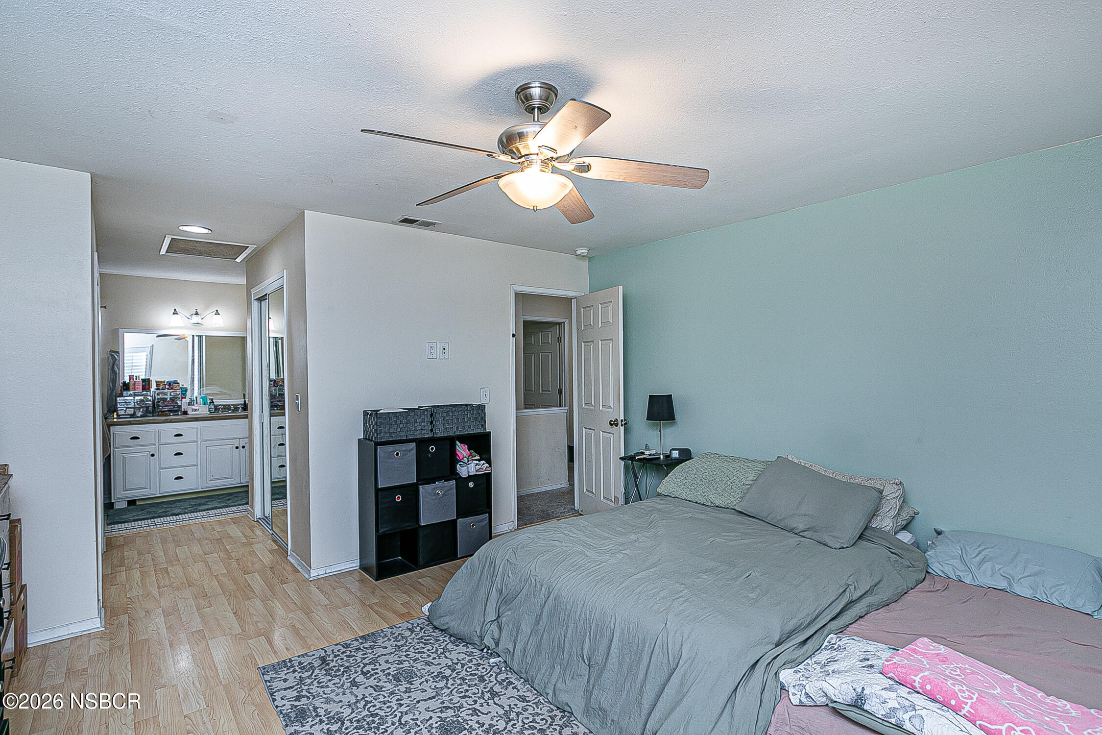 712 Pebble Beach Place Santa Maria, CA 93454 - Photo 21 of 31 a bedroom with a bed and a chandelier