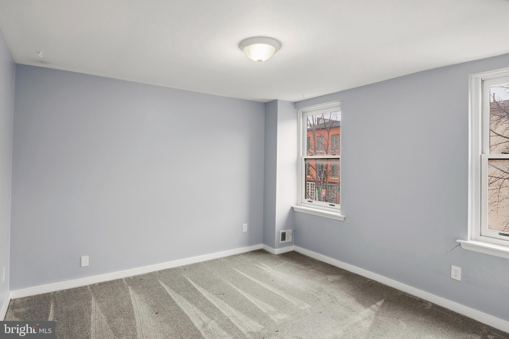 636 Portland Street Baltimore, MD 21230 - Photo 10 of 20 an empty room with windows
