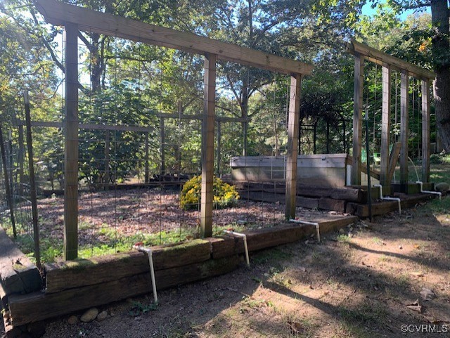1386 Page Road Midlothian, VA 23113 - Photo 46 of 48 Gardening beds with irrigation pipes, arbors