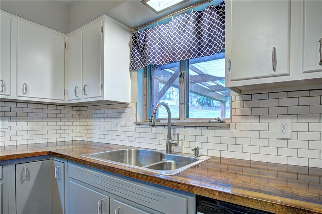 118 Siebert Road Pittsburgh, PA 15237 - Photo 11 of 25 a kitchen with a sink cabinets and a window