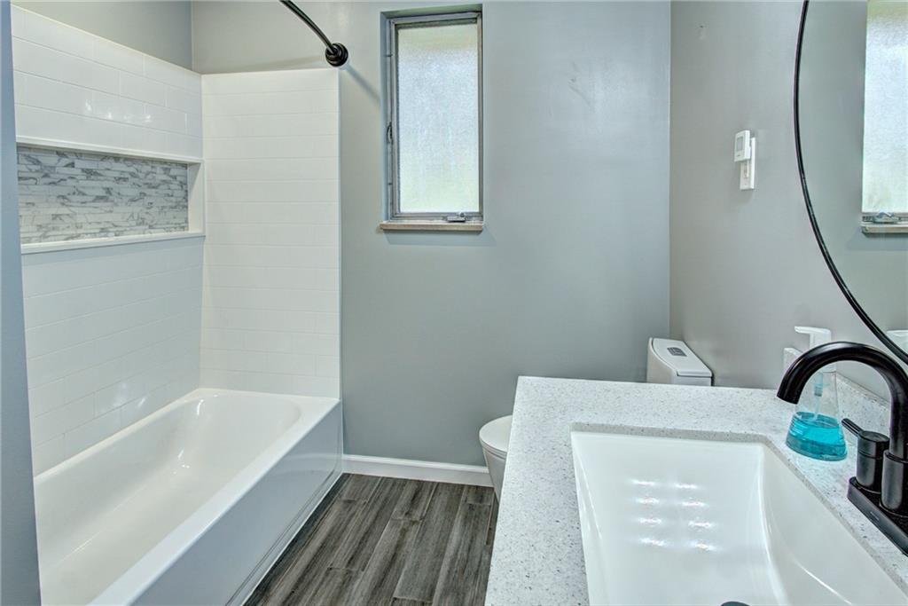 118 Siebert Road Pittsburgh, PA 15237 - Photo 15 of 25 a bathroom with a sink a bathtub and a shower